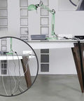 Desk setup showing self closing cable sleeve for flexible cable management at desks, PCs, TVs, heat fire and UV resistant, black