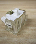 Heavy Duty Ht8a Normally Open Contact Block For Thirty Millimeter Push Buttons And Switches Industrial Grade Replacement Hardware on a wooden surface.