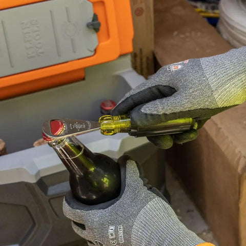 Bottle Opener For Pros With Cushioned Grip Handle And Tip Ident For Quick ID In Pouches Made In USA being used on bottle.