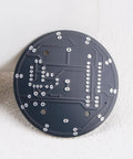 Back view of DIY electronics board from Two Pack NE555 Electronics Kit For Soldering Practice And LED Prize Wheel Project