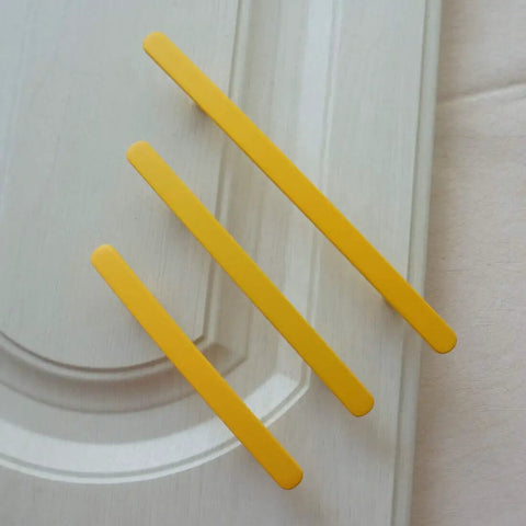 Bright Yellow Zinc Alloy Drawer Pulls For Kitchen Cabinets And Dressers With Multiple Hole Centers Like Three Inches on a cabinet.