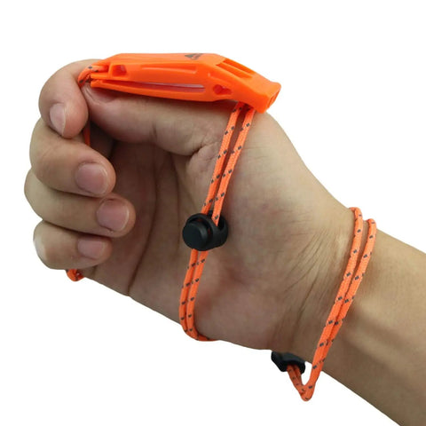 Person holding Ultra Loud Double Chamber Emergency Whistle With Lanyard For Kayaks Boats Life Vest And Outdoor Adventures Pealess 120dB Survival Signal For Hiking Camping Fishing And Rescue 2 Pack