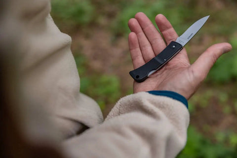 Person holding Six Point One Inch Lightweight EDC Folding Knife With Stainless Steel Blade USA Made Lock Back Tactile Grip