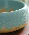 Close-up of Killer Vintage Ceramic Pedestal Sink Slick Blue hand-carved washbasin highlighting texture and glaze finish.