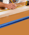 T Track Miter Track Jig For Woodworking Aluminum Alloy T Slot Track with Quick Acting Clamp next to carpenter measuring wood piece