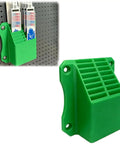 Rock Solid Reciprocating Saw Blade Organizer Wall Mount Holds Up To 16 Blades Pegboard Gear Stash Rack holds saw blades in green plastic design.