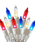 Close-up of Patriotic Red White Blue Mini String Lights 100 Count with white wire for indoor outdoor holiday decor.