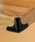 Silicone Corner Guards 4 Pack For Furniture And Tables, black corner guard on wooden table edge