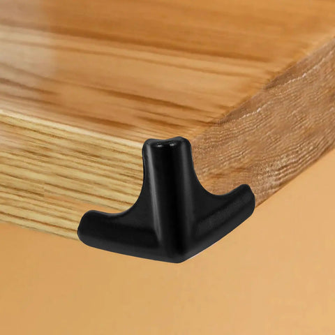 Silicone Corner Guards 4 Pack For Furniture And Tables, black corner guard on wooden table edge