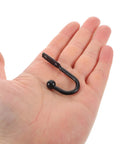 Grab These Bad Boys 12 Pack Black Mini Metal Wall Mount Coat Hooks For Doors And Walls Vintage Style Single Prong Design held in hand.