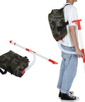 Manual Fertilizer Spreader With Bag For Farm Crops And Garden Use shown on person with ergonomic grip and camouflage backpack.