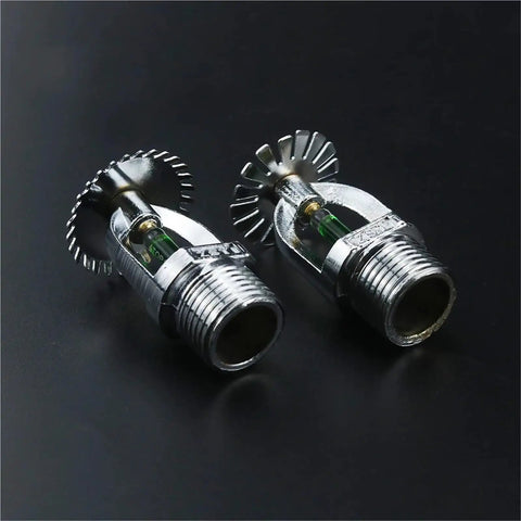 Top Shelf Pendent And Upright Fire Sprinkler Heads One Half Inch Dn Fifteen Copper Frame Glass Bulb Armor For Gymnasiums And Commercial Buildings Five Pack angled photo of chrome fire sprinkler heads with glass bulbs.