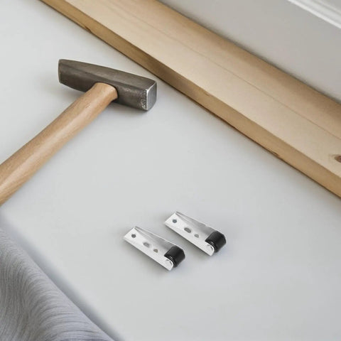 Top Shelf Heavy Duty Sliding Door Track Rollers With Silky Smooth Swivel Caster Wheels For Closet Cabinet Wardrobe Furniture Silent Zero Hassle Black Composite Four Piece Set displayed with a hammer and wood.