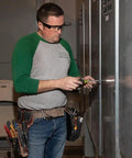 Person using Magnetic Multi-Bit Screwdriver And Nut Driver, 11-In-1 with Eight Bit Tips and Three Nut Driver Sizes