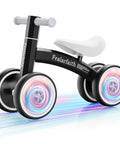 Black toddler balance bike with four colorful LED wheels that light up when they move, no batteries needed, for 10 to 36 month boys and girls.