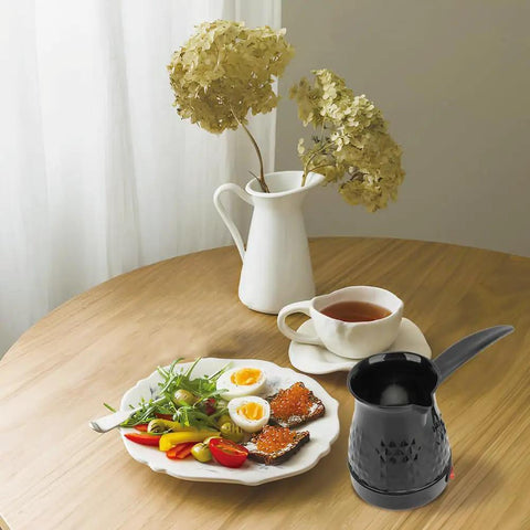 Table setting with Electric Turkish Coffee Maker 500ml Pot With Removable Handle, breakfast plate, and cup of tea