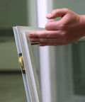Sliding Patio Door Roller Assembly With 1-1/8 Inch Steel Wheel being installed, showing transition of frame and roller application.
