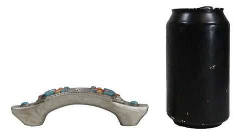 Set Of Four Hella Stylish Southwestern Turquoise Cross Drawer Pulls With Sparkling Rhinestone beside a black soda can for size reference.