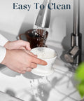 Porcelain Pour Over Coffee Dripper Non Electric Hands On No Fuss Manual Brew Maker White ceramic being washed under sink