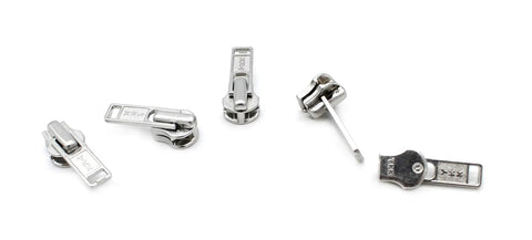 Zip Repair Kit With Metal Aluminum Sliders And Top And Bottom Stops, Assorted Sizes 3, 4.5, 5, And 10, Easy Storage Container, Fix Broken Zippers Fast, showing assorted metal aluminum zipper sliders.