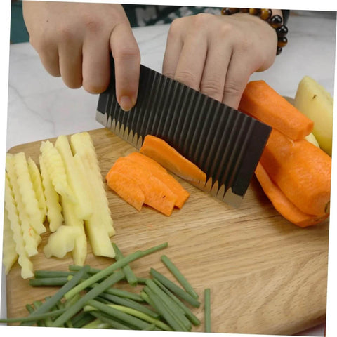 SOLUSTRE wavy chopper knife crinkle slicer, stainless steel; side view slicing carrot on cutting board.