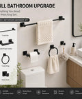 Matte Black 4-Piece Bathroom Hardware Set, Stainless Steel Wall Mounted Kit With 23.6 Inch Towel Bar, Toilet Paper Holder, Towel Ring, Robe Hook displayed above a toilet and sink in a modern bathroom.