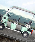 Four Passenger Electric Golf Cart Cruiser Boasting Smooth Riding Solid Steel Rig And Roomy Rear Cargo Area with two seats visible.