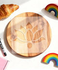 Lotus Flower Acrylic Router Template Seven Nine Inch Square Dead On Clear Floral Inlay Guide over wooden tray with croissant.