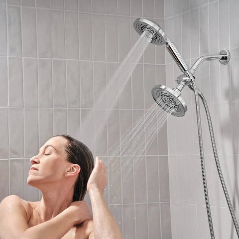 Woman enjoying Two-Head Shower System With Five Settings In Polished Chrome, Low Flow 2.0 GPM, 688 streams total for relaxation
