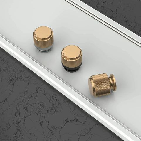 Front view of Matte Black And Champagne Bronze Kitchen Cabinet Knobs Set Of 10 for dresser drawers zinc knobs on table surface.