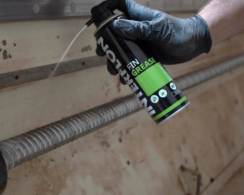Industrial Food Grade Workhorse Grease Spray With MicPol Technology being applied to machinery by gloved hand