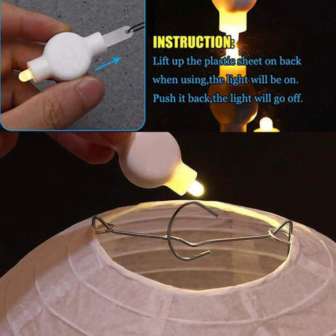 Battery Operated Hanging LED Lights For Paper Lanterns Warm White 12 Pack Easy Clip On in use on a paper lantern