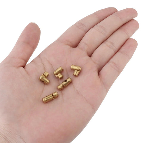 Hidden Brass Barrel Hinges 5 mm For DIY Jewelry Cabinets And Wooden Boxes, 135 Degree Concealed Small Hinges For Tiny Projects, Invisible Hinges Pack Of 20 Durable Rust Resistant Hardware By HOJLKLD shown in hand