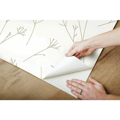Person peeling Brown And White Twigs Peel And Stick Wallpaper Roll For Easy Wall Makeover, Nature Inspired Pattern, removable decor