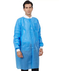 Man wearing disposable lab coat pack of 10 in blue SMS polypropylene anti static fluid resistant breathable with pockets adult size medium