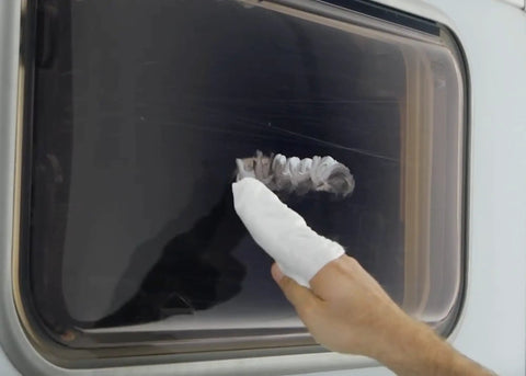 Applying Acrylic Scratch Remover for Clear Plastic and Plexiglas on vehicle window to remove scratches fast with pro grade results