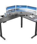 Corner Standing Desk With Electric Height Adjustment 63 X 55 Inch Reversible L Shaped Workstation with monitors on black top