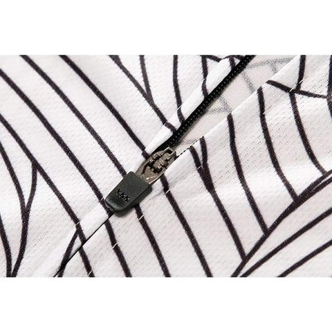 Close-up of a black zipper on white fabric with black stripes