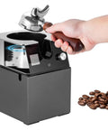 Automatic Espresso Puck Remover Silent Knock Box Swap For Portafilters Fast Ground Coffee Clearance With Heavy Duty Stainless Brush Heads For Zero Hassle Cafe Routines 220V with portafilter being placed.