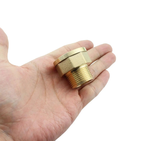 Beefy Lengthened Brass Extension Fittings 1 Inch By 1.25 Inch Adapter held in hand, shows thickened female pipe fitting and golden finish.
