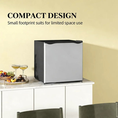 Compact Upright Freezer Silver 1.1 Cu Ft Countertop Mini Freezer on a countertop with fruit and drinks beside it.