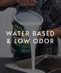 Person pouring Clear Water Based Primer Sealer For Drywall And Wallpaper, Low VOC 5 Gallon Kit into a tray