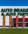 Repair Shop Promo Pack With Four Feather Flag Kits in front of auto brake and auto parts store, boosting local visibility and foot traffic.