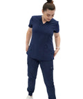 Women's V Neck Scrub Top Delivering Killer Comfort And Sharp Navy Styling Crafted For Nurses Wanting Fresh Medical Uniform Looks That Hit Dead Perfect Through Every Busy Clinical Shift, worn by model.