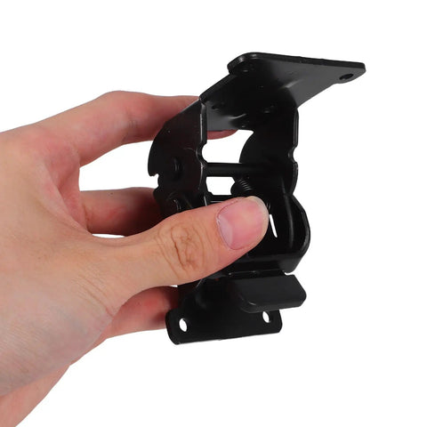 Hand holding Black Iron Folding Leg Hinges With Anti Loosening Technology And Smooth Silent Operation For Hidden Furniture Corner Connectors.