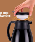 Keep Coffee Hot All Day With This Double Walled Vacuum Insulated Carafe 56 Ounce Thermal Urn With Stainless Steel Interior And BPA Free Exterior Ideal For Home Or Office No Spill Design Easy Pour Spout Black showing leak-proof silicone seal