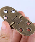 Heavy Duty Antique Brass 180 Degree Flip Top Hinges For Sewing Machine Tables And Folding Furniture No Sweat Setup Smooth Swing Pivot Hardware 2 Pack held in hand.