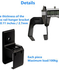Heavy Duty Box Rail Hanger Bracket For Exterior Barn Door Hardware Rail Mount Bracket With Included Bolts Black 4 Pack Durable Rust Resistant Alloy Steel Construction For Outdoor Use, close-up of black bracket and measurement tool, 2.7mm thick, 100kg load capacity