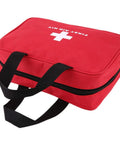 Red first aid kit bag with black handles and zip closure; front view, empty contents