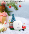 Smart Thermometer Hygrometer With WiFi And App Alerts displayed among holiday decorations.